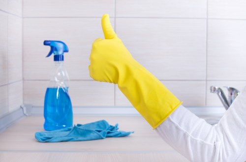 Kitchen surfaces being thoroughly cleaned during deep cleaning in SW9