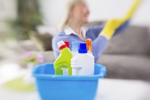 Floor care specialist performing detailed hard floor cleaning in SW9