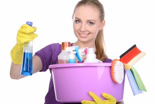 Local home cleaning team in SW9 vacuuming carpets and dusting surfaces